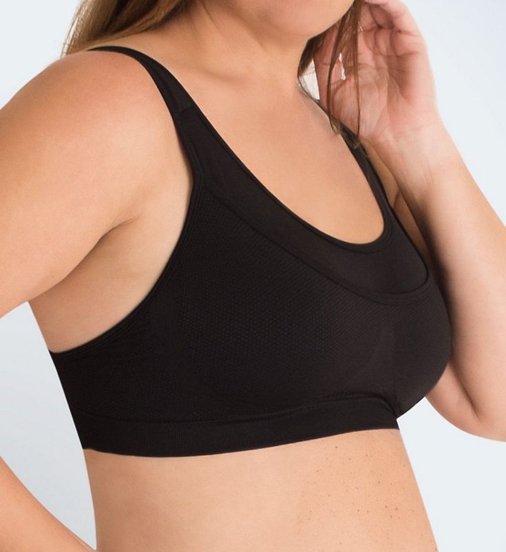 This medium impact sports bra features wide, padded straps that easily convert to a crossback and a seamless stretch fabric underband for comfortable support. Made from nylon and spandex. Wireless, seamless cups are unlined (unpadded). Front has double-layer seamless stretch fabric for better support and opacity. Key pocket at top left front. Breathable mesh front has a knit-in center triangle to separate breasts. Knit panels create encapsulation for a better fit. Full coverage neckline edges ha Solid Nylon Sports Bra With Built-in Bra, Supportive Stretch Bra With Built-in Padding, Supportive Sports Bra With Built-in Bra, Supportive Nylon Sports Bra With Built-in Padding, Contoured Sports Bra With Built-in Padding For Gym, Black Stretch Bra With Built-in Padding, Black Sports Bra With Built-in Bra And Medium Support, Supportive Full Coverage Sports Bra With Built-in Bra, Sporty Contoured Sports Bra With Built-in Bra