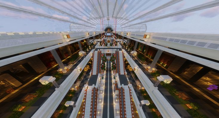 an aerial view of the inside of a building with many tables and chairs in it