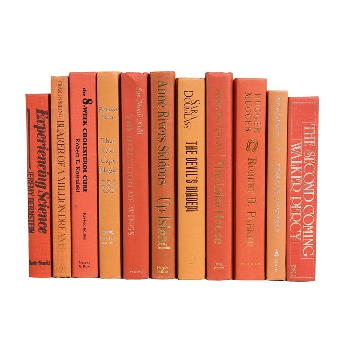 a row of orange books sitting on top of each other