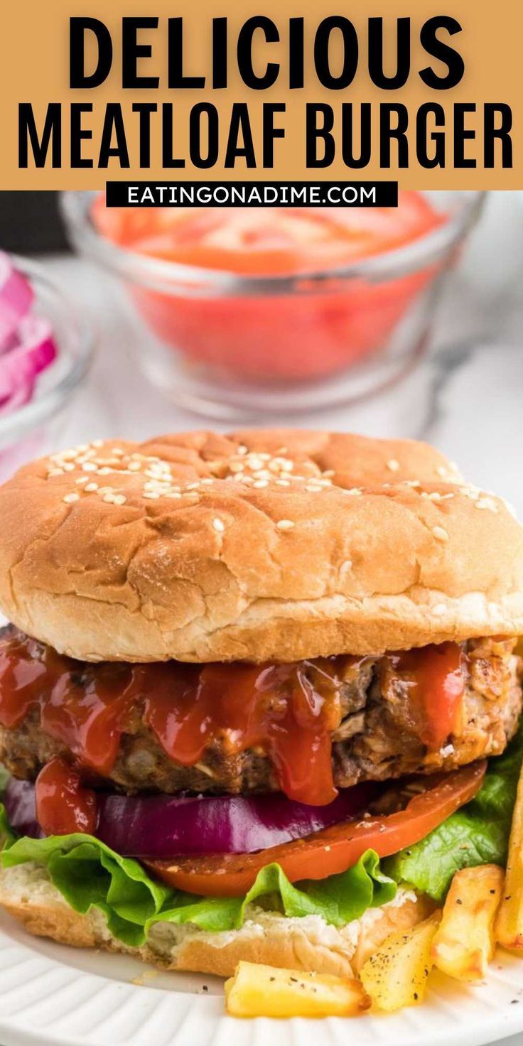 a delicious meatloaf burger with lettuce, tomato and onions on a white plate