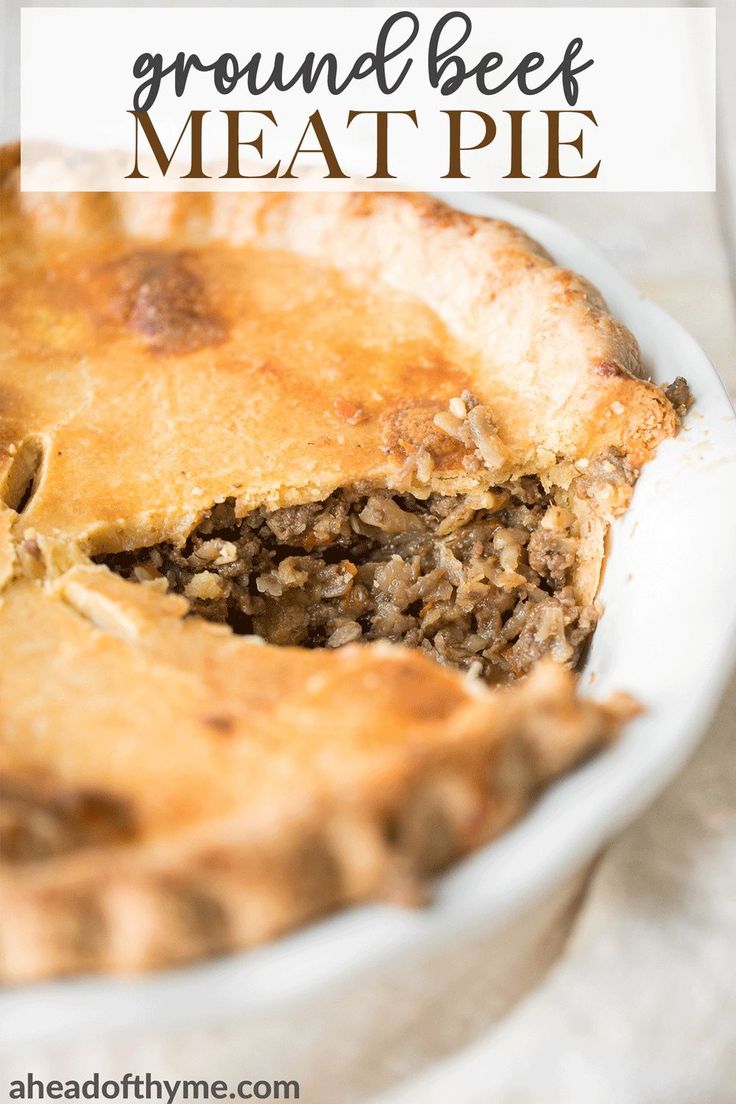 a close up of a pie on a plate with the words ground beef meat pie