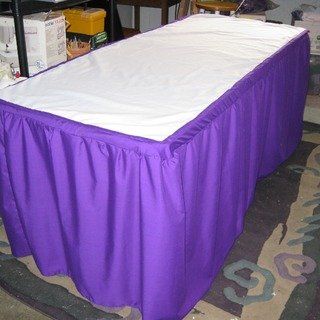 a table with a purple cover on it