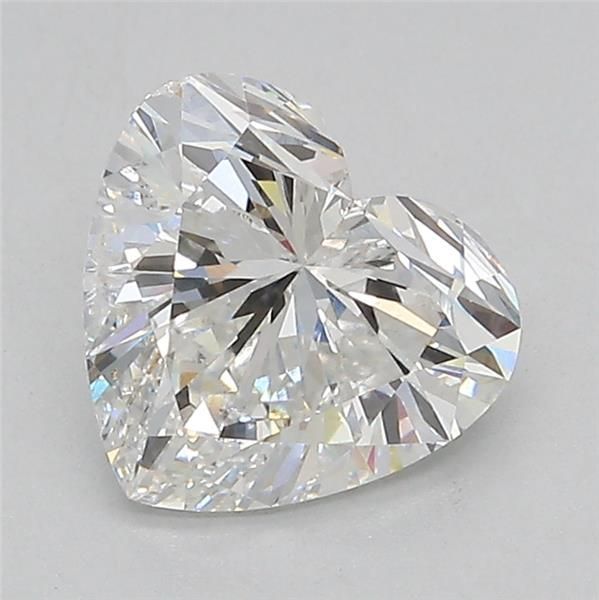 a heart shaped diamond on a white surface