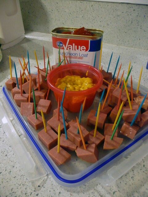 there are many sticks sticking out of the food on the tray and in the bowl