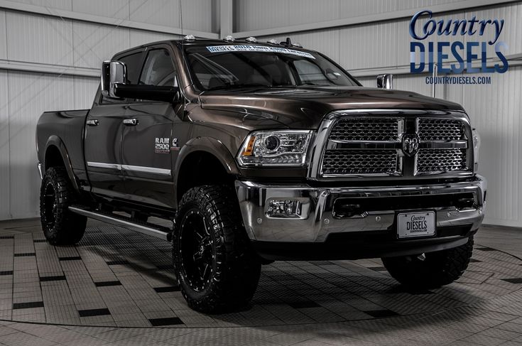 a large truck parked in a garage with the words country diesel on it's side