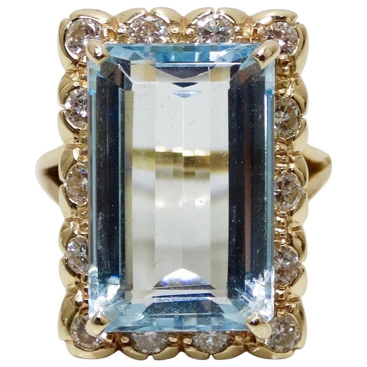 Elevate your evening looks with this stunning Aquamarine cocktail ring! Circa mid-20th century and set in a split style 18k Gold band, this Victorian style ring features an Aquamarine baguette cut center gemstone at approximately 12 carats with a frame of brilliant round cut Diamonds. Total weight in grams is 9.25 and was made to fit a size 7. A true vintage treasure, this ring will pair perfectly with your favorite Dior evening dress and Chanel clutch! Dior Evening Dress, Diamond Baguette Ring, Aquamarine Cocktail Ring, Victorian Style Rings, Hand Candy, Victorian Jewellery, Chanel Clutch, Baguette Diamond Rings, Baguette Ring