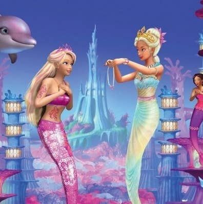 two mermaids are standing in front of a dolphin