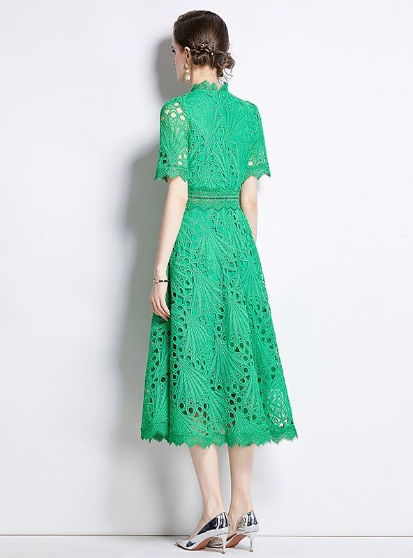 Overlaid with intricacy, this stunning green lace dress is a masterpiece of design, a garment that marries modern sophistication with timeless elegance. The high neckline and keyhole back offer glimpses of skin beneath the delicate floral lace, which runs down the length of the dress in intricate patterns. Its mid-length cut and cinched waist create a flattering silhouette, while the carefully crafted lace exudes a sense of refined grace. The cap sleeves add a touch of modesty, balanced by the d Green Lace Dress, Short Sleeve Lace Dress, Sleeve Lace Dress, Green Lace Dresses, Evening Jackets, Contemporary Chic, Green Lace, Sandals For Sale, White Midi Dress