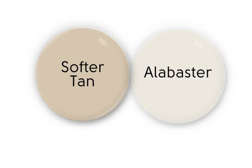 two white buttons with the words softer than and albabaster written on them