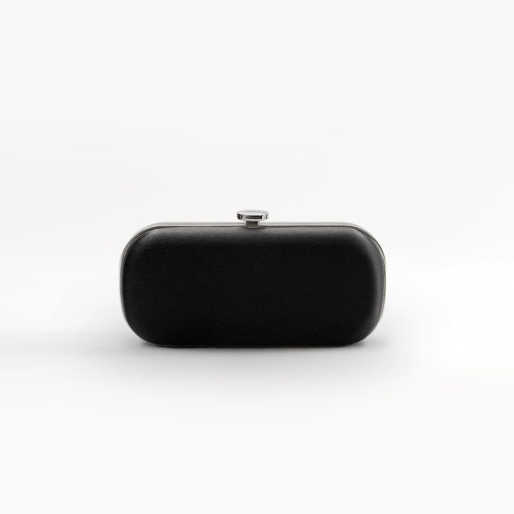 The Black Bella Clutch is a duchess satin designer bridal and evening clutch, perfect for a divine, fancy black-tie occasion on your calendar! The Black Bella Clutch makes a statement! Designed with a contemporary vision, the Black Bella Clutch is made of duchess satin and crafted by the finest Italian artisans. The perfect accessory to complete a refined and glamorous black-tie outfit, The Black Bella Clutch will become a staple in your wardrobe. Paired best with silver hardware! The Bella Clut Chic Black Clutch With Rectangular Case, Elegant Black Clutch For Gala, Chic Black Evening Bag For Gala, Chic Black Rectangular Clutch, Black Rectangular Evening Bag For Gala, Black Evening Bag For Gala, Modern Formal Evening Bag, Modern Evening Clutch With Rectangular Case, Black Rectangular Clutch For Parties