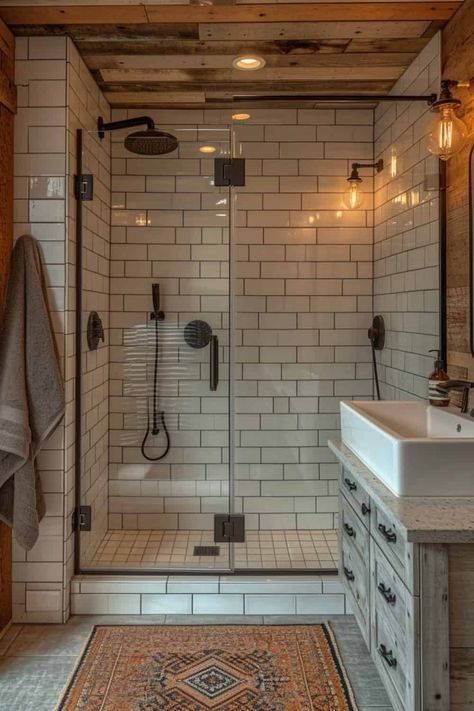 a bathroom that has a rug on the floor in front of it and a shower