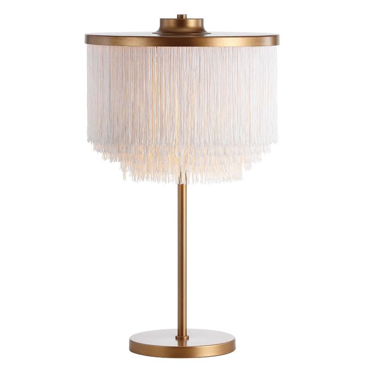 a gold table lamp with a white shade on the base and a round light fixture