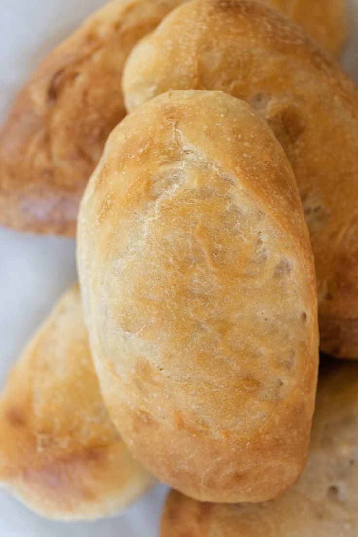 some bread rolls stacked on top of each other