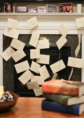 many pieces of paper are stuck to the fireplace