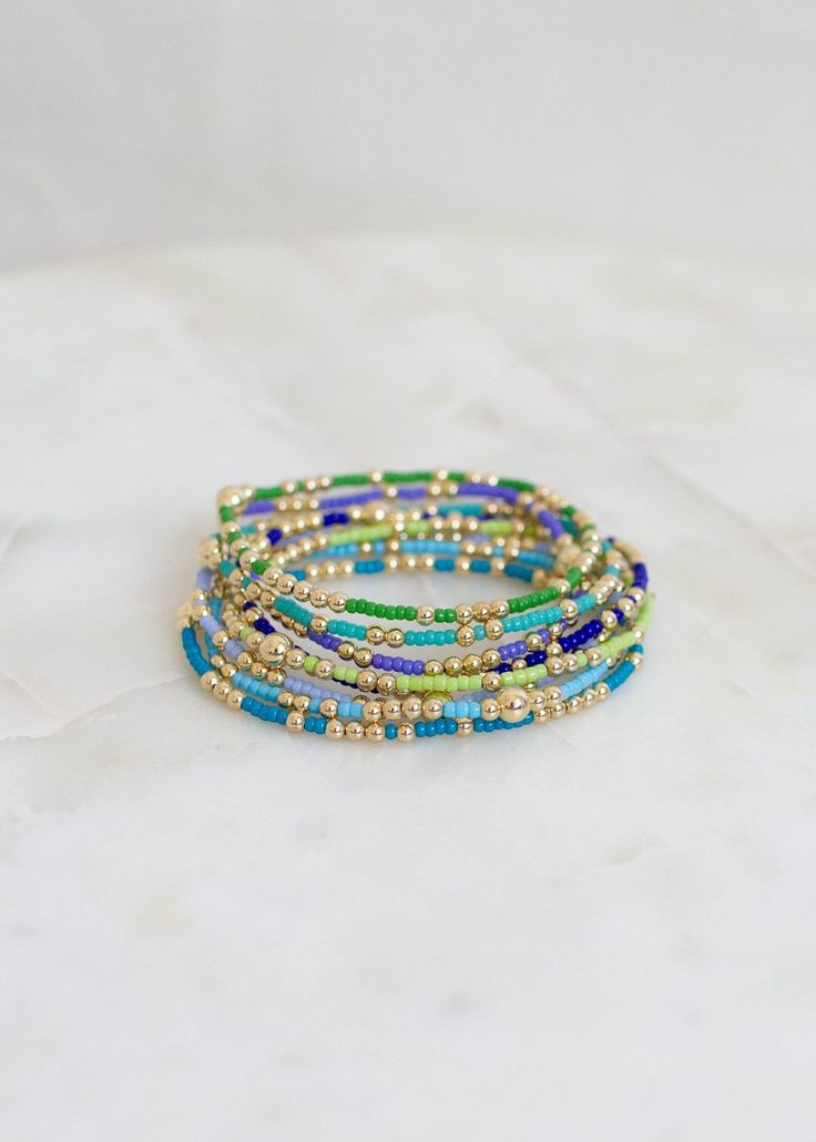 "❖Olivia Bracelet❖ * Your new favorite bracelet! Delicate and minimalistic, perfect for stacking! ‣ This listing is for a single bracelet. ‣ Buy more, save more - applied at checkout      * 3 10% off      * 5, 15% off      * 7, 20% off ‣ Olivia bracelet features: * 2mm Seed Beads * 3mm 14k Gold Filled Beads in random order * 1-5m 14k Gold Filled Bead Julisa Bracelets Feature:  ‣ Tight/Sturdy elastic, pre-stretched to prevent bracelet from stretching out ‣ Sizing according to wrist size ‣Sizing T Minimalist Green Beaded Bracelets With Tiny Beads, Minimalist Green Beaded Bracelet With Tiny Beads, Blue Stretch Bracelet With Tiny Beads, Blue Bangle Bracelet With Tiny Beads, Adjustable Turquoise Beaded Bracelet With Gold Beads, Teal Seed Bead Bracelet, Olivia Bracelet, 14k Gold-filled Blue Bracelet, Teal Bracelet