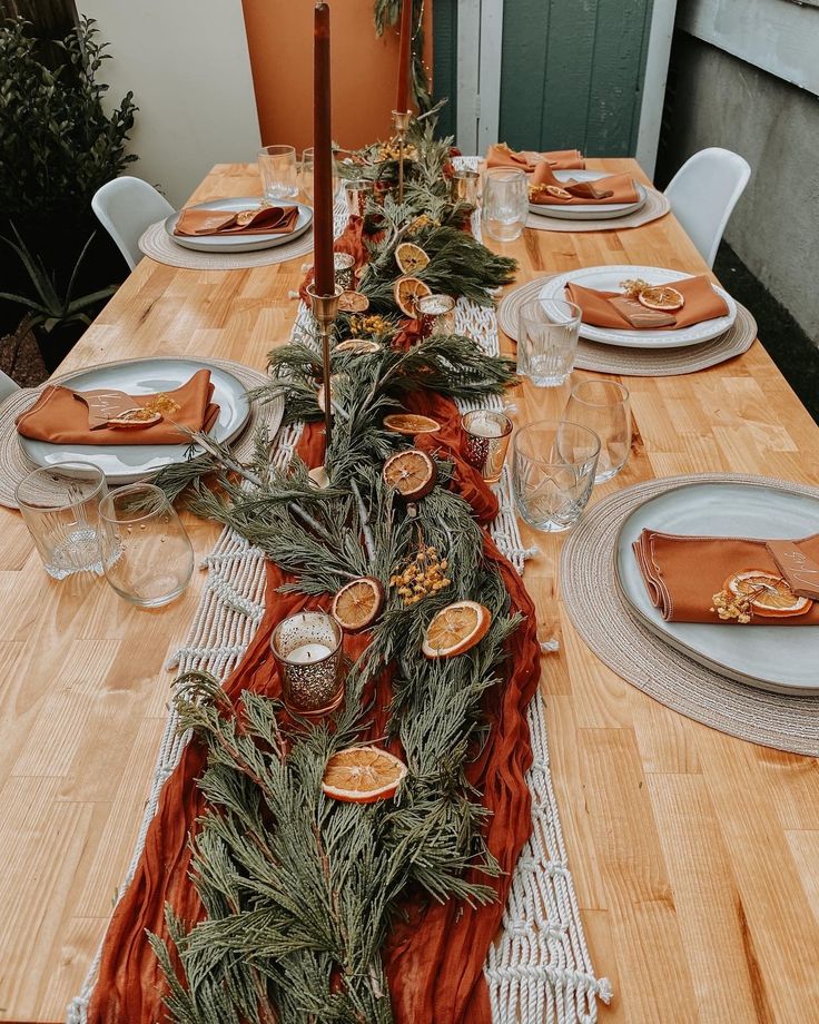 the table is set with plates and place settings