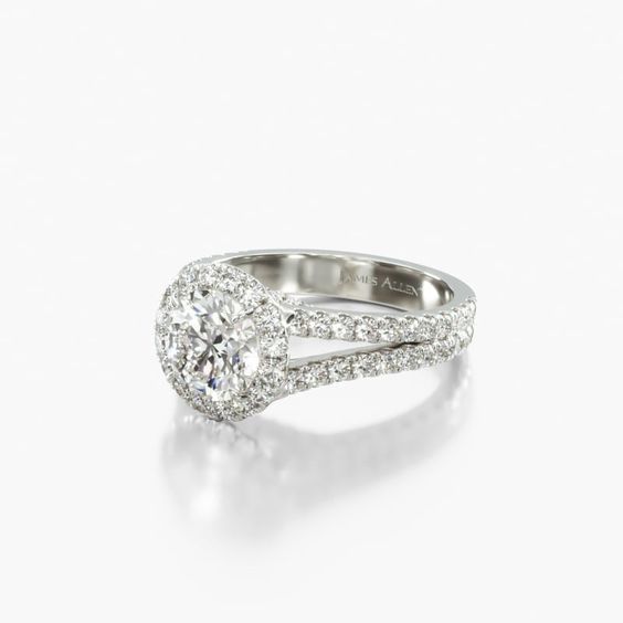 an oval shaped diamond ring with split shans