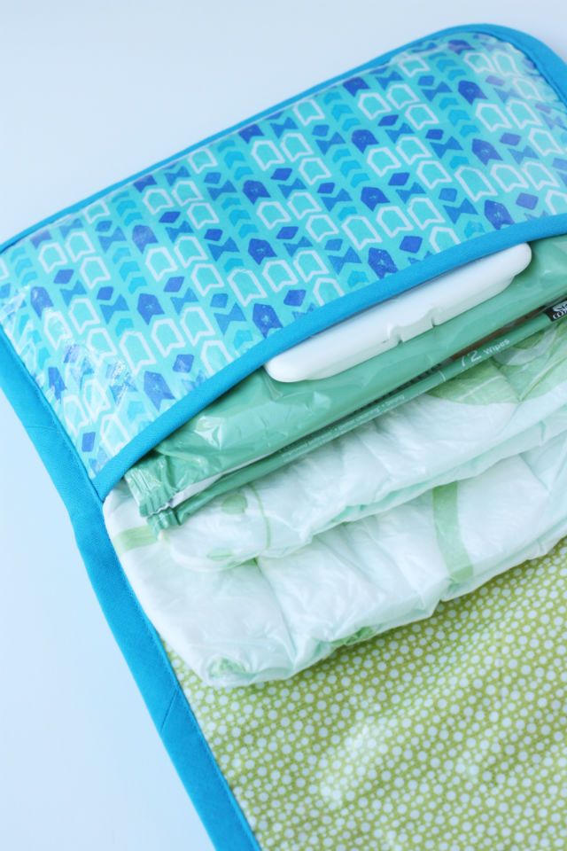 a blue and green blanket folded on top of each other