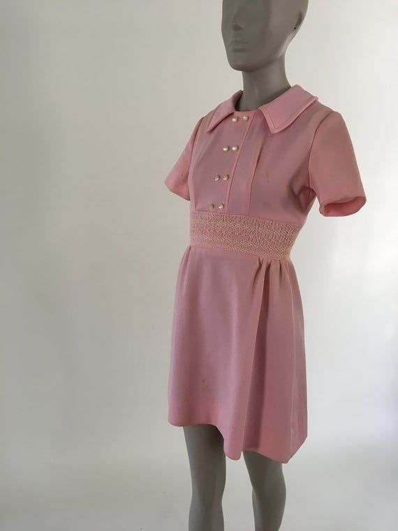 Vintage 1970's Pink Polyester Girl's Peasant Mini Dress, Size XS Pink Mini Vintage Dress For Summer, Pink Mini Length Vintage Dress For Summer, Retro Pink A-line Mini Dress, Pink Vintage Mini Dress With Short Sleeves, Pink Mini Vintage Dress For Spring, Pink Fitted A-line Vintage Dress, Vintage Pink Mini Length Dress, Vintage Pink A-line Dress, Pink Retro Dresses For Daywear