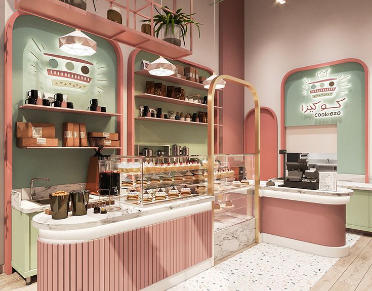 the inside of a store with pink and green walls, white counters and shelves filled with goods