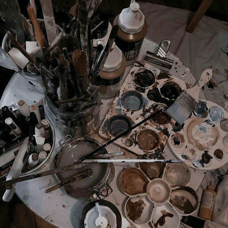 an assortment of dirty dishes and utensils on a table