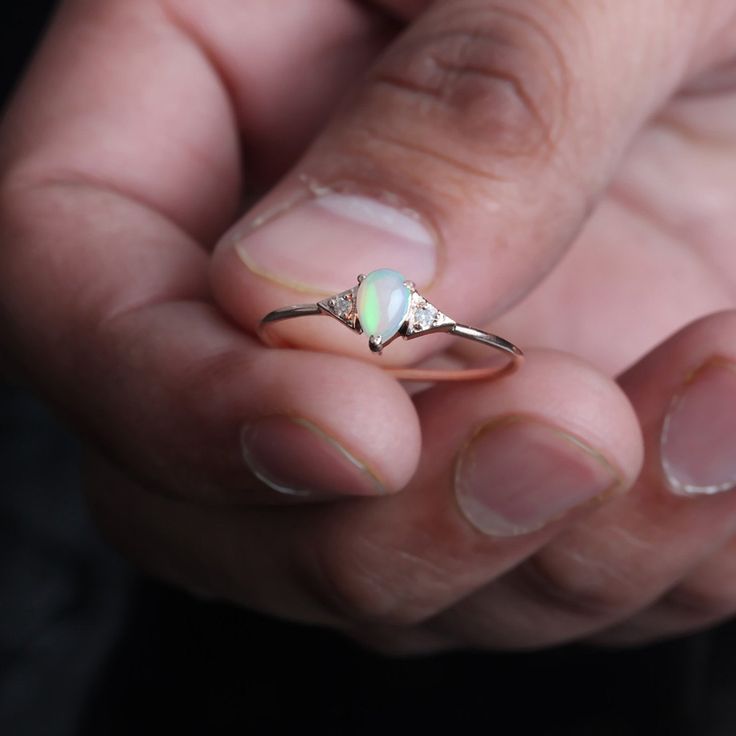 ⚫ This ring made with natural pave diamond & opal in solid 14k rose gold, ⚫ Solid 14k Gold Pave Diamond Opal Ring Handmade Pure Gold Jewelry. ⚫ Diamond Ring, Opal Ring, Engagement Ring, Wedding Bands, Gold Ring, Gemstone Ring ⚫ Special customize for Anniversary, Birthday Gift, Valentine, Mother's Day Christmas. ⚫ Item Details: Gross Weight :- 1.03 Grams 14k Rose Gold Weight :- 0.96 Grams Diamond Weight :- 0.03 Carats Opal Weight:- 0.30 Carats Ring Size 7 ( can be customized) Item SKU: YTR-21 Delicate Diamond Wedding Jewelry, Wedding Diamond Jewelry, Delicate 14k Rose Gold Wedding Rings, Delicate Wedding Rings In 14k Rose Gold, 14k Rose Gold Round Jewelry For Wedding, 14k Rose Gold Jewelry For Wedding, Delicate 14k Gold Opal Ring For Anniversary, Delicate Opal Gemstone Ring For Wedding, Dainty 14k Rose Gold Diamond Wedding Ring