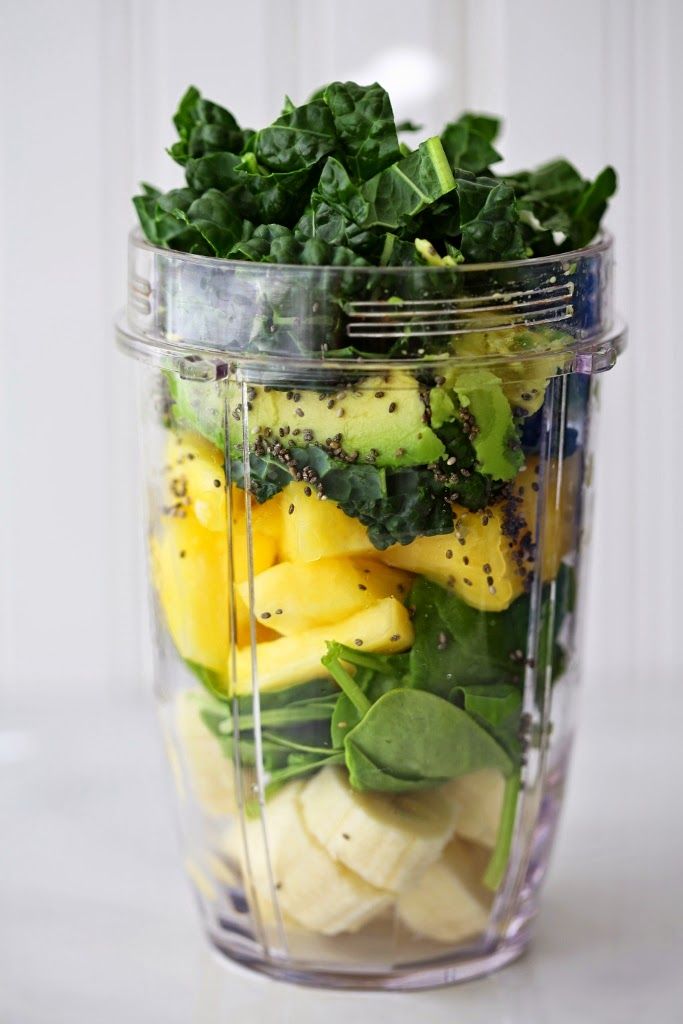 a blender filled with different types of fruits and vegetables