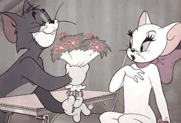 two cartoon cats sitting on a table with flowers in their hands