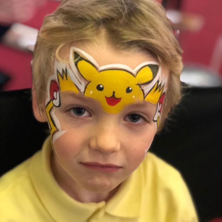 Pikachu by Emerald Face Painting Pikachu Face Paint, Pokemon Facepaint, Fox Face Paint, Easy Face Painting Designs, Pikachu Face, Pokemon Faces, Face Painting For Boys, Grumpy Face, Face Painting Tutorials