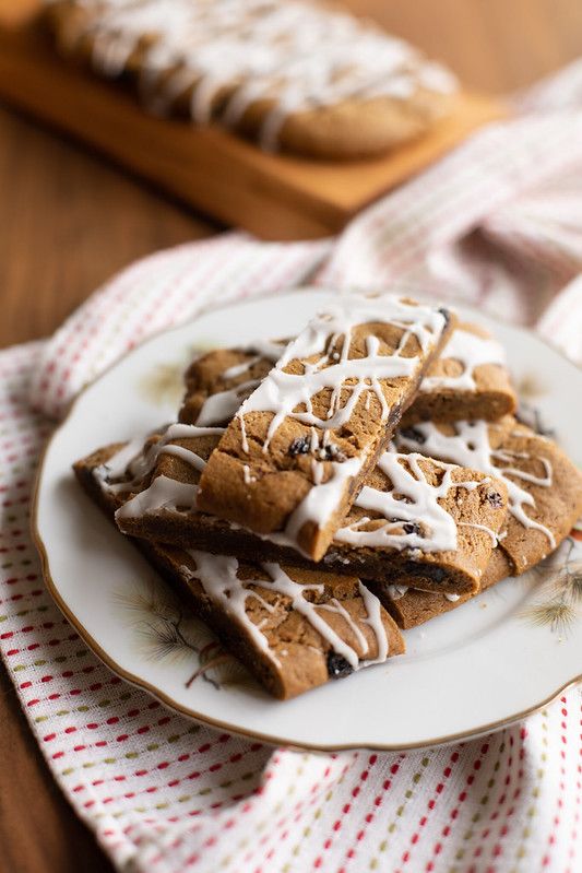 a plate topped with cookies covered in icing