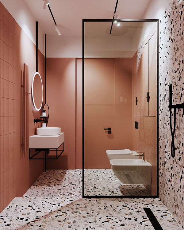 a bathroom with pink walls and flooring next to a white sink under a mirror