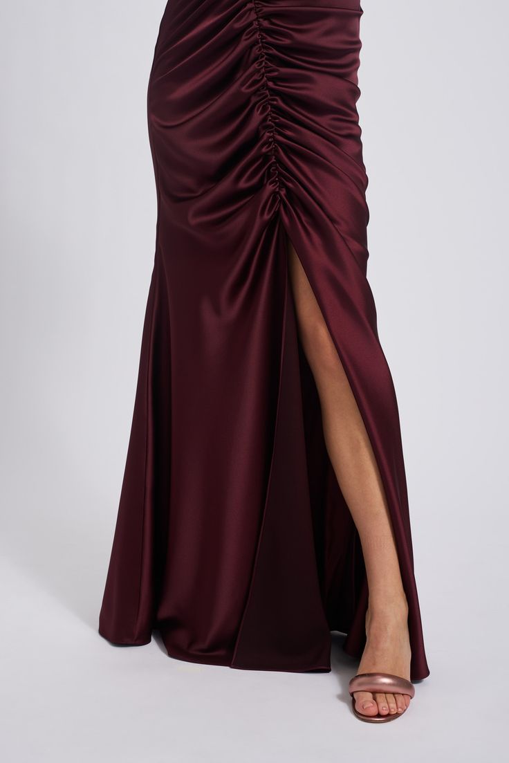 Fluid satin asymmetric shirred fit-to-flare dress. Shown in Ruby. Formal Asymmetrical Satin Dress, Silk Dresses With Ruched Sides, Asymmetrical Satin Dress For Formal Occasions, Asymmetrical Satin Finish Formal Dress, Asymmetrical Formal Dress With Satin Finish, Asymmetrical Fitted Satin Dress, Asymmetrical Dress With Satin Finish For Formal Occasions, Elegant Dress With Gathered Skirt For Gala, Elegant Party Dress With Gathered Skirt