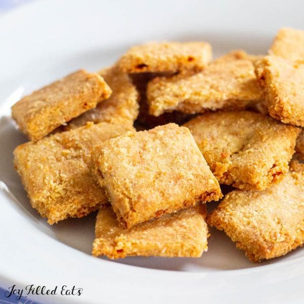 a white plate topped with cut up squares of food