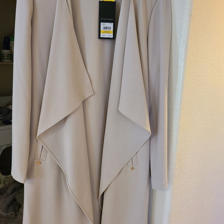 Brand New Nine West Jacket. Very Light And Sheik. Elegant Open Front Outerwear With Pockets, Elegant Cream Open Front Outerwear, Elegant Cream Open-front Outerwear, Spring Workwear Outerwear: Long Coat, Spring Workwear Long Coat, Spring Long Coat For Workwear, Formal Winter Outerwear With Open Front, Chic Long Sleeve Neutral Outerwear, Chic Open Front Outerwear For Spring