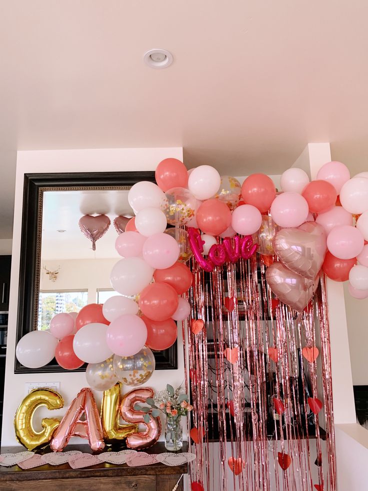 balloons and streamers are hanging from the ceiling