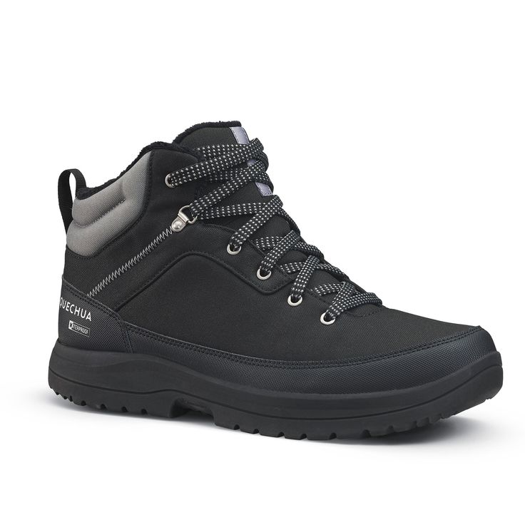 a pair of black hiking boots on a white background