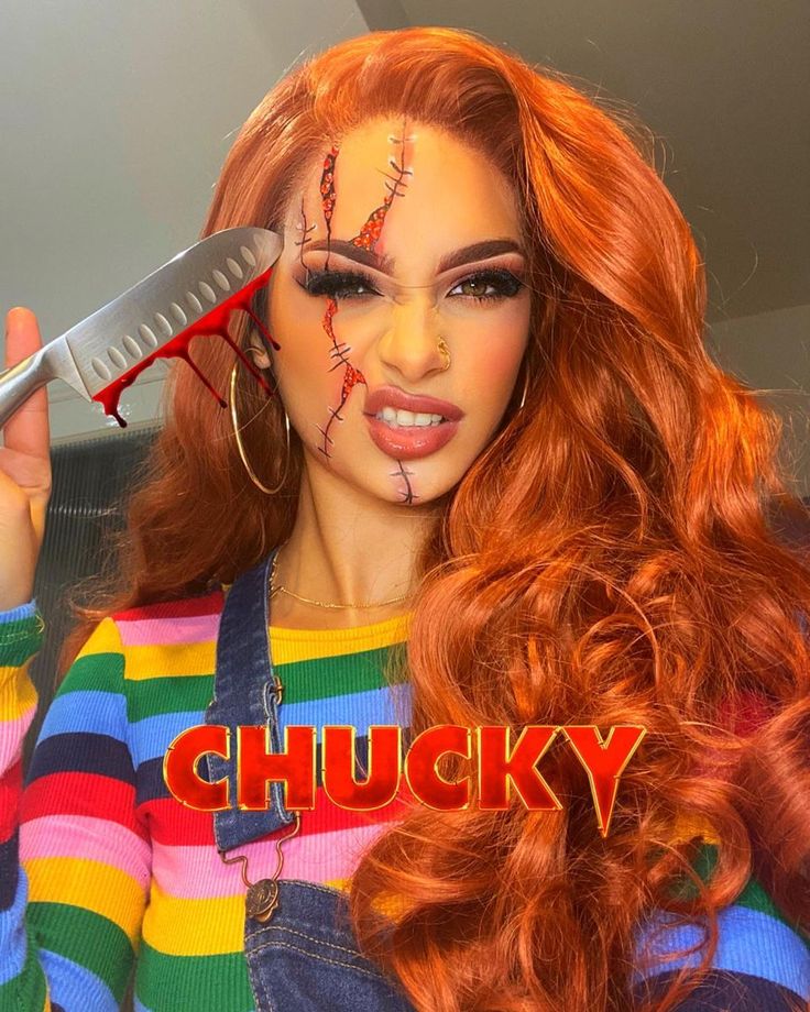 a woman with red hair and makeup is holding a knife in front of her face