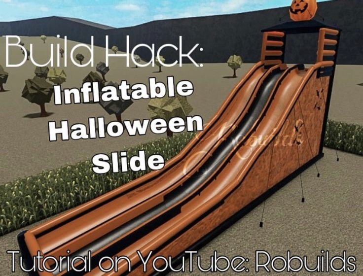 an inflatable halloween slide with pumpkins on top and text overlaying it