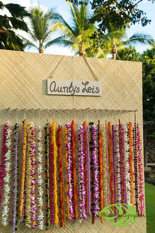 there are many leis hanging on the wall