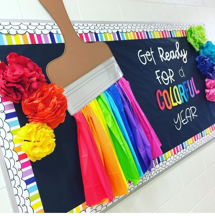 a bulletin board with colorful paper flowers and a paint brush on it that says, get ready for the school year