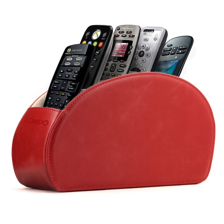 a red leather case holds several remotes and cell phones in it, as well as a phone holder