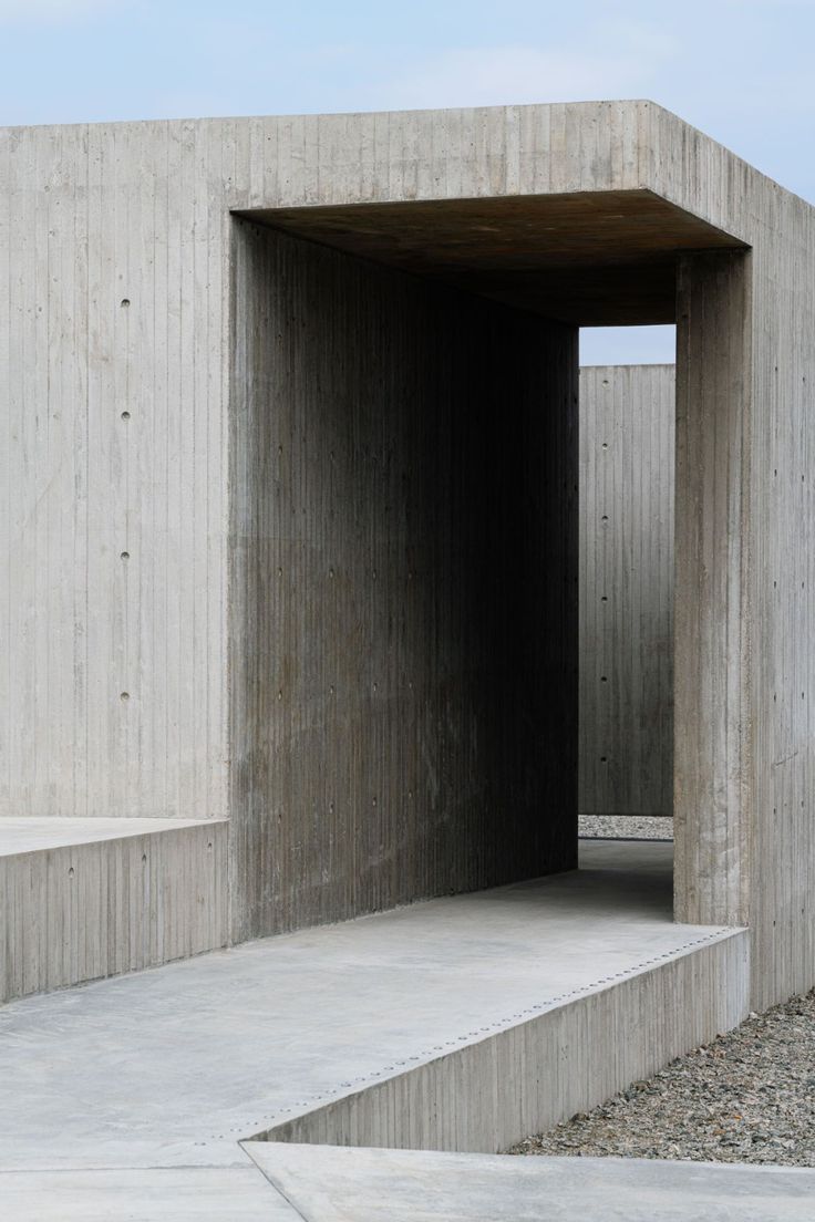 an empty concrete structure with steps leading into it