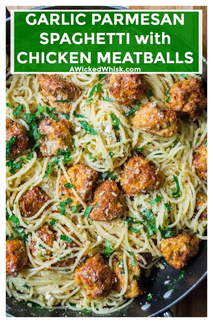 garlic parmesan spaghetti with chicken meatballs in a skillet