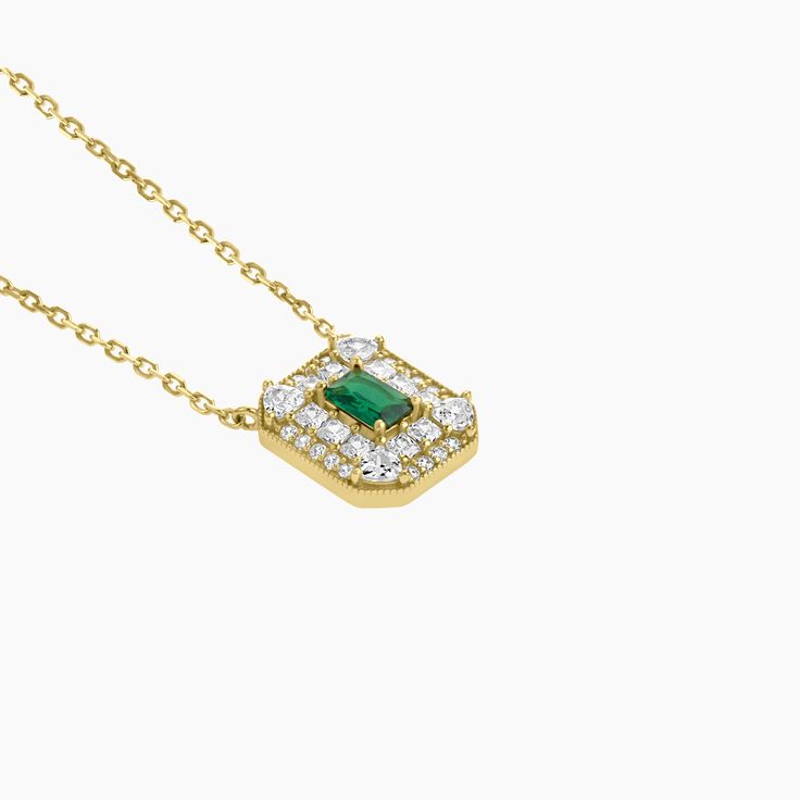 Elevate your style with our stunning Art Deco Necklace, plated in lustrous gold over sterling silver. Featuring a mesmerizing green spinel in an emerald cut as the center stone, this necklace is a true statement of elegance. The intricate design surrounding the center stone adds a vintage-inspired touch, paying homage to the Art Deco era. With a length of 16 inches plus a 2-inch extension, this necklace offers versatility in wearing and allows for the perfect fit. Art Deco Necklace, Art Deco Era, Intricate Design, Emerald Cut, Vintage Inspired, Emerald, Perfect Fit, Art Deco, Plating