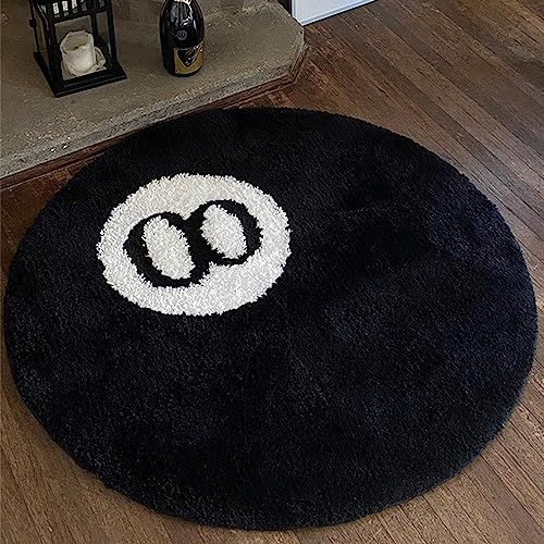 a black and white rug with the letter o on it in front of a fireplace