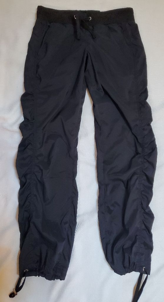 Drawstring Waist And Ankle Bnwt. Dry Wick Fitted Sports Bottoms With Drawstring, Fitted Black Bottoms With Drawstring, Fitted Sports Pants With Drawstring, Casual Black Bottoms With Ruched Sides, Fitted Black Parachute Pants With Elastic Waistband, Black Stretch Parachute Pants With Drawstring, Fitted Black Nylon Parachute Pants, Fitted Nylon Bottoms With Drawstring, Black Nylon Drawstring Bottoms