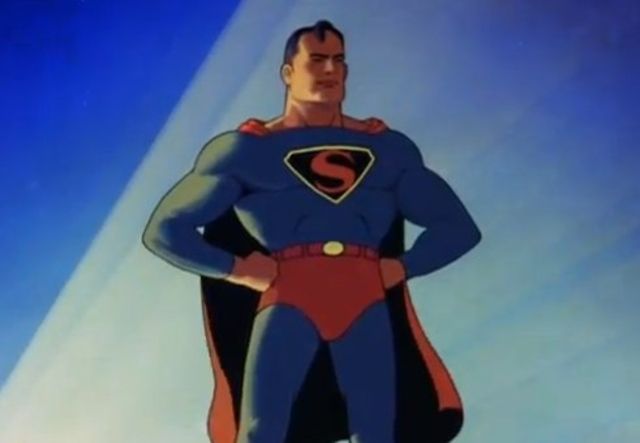 superman standing with his hands on his hips in front of a blue and white sky