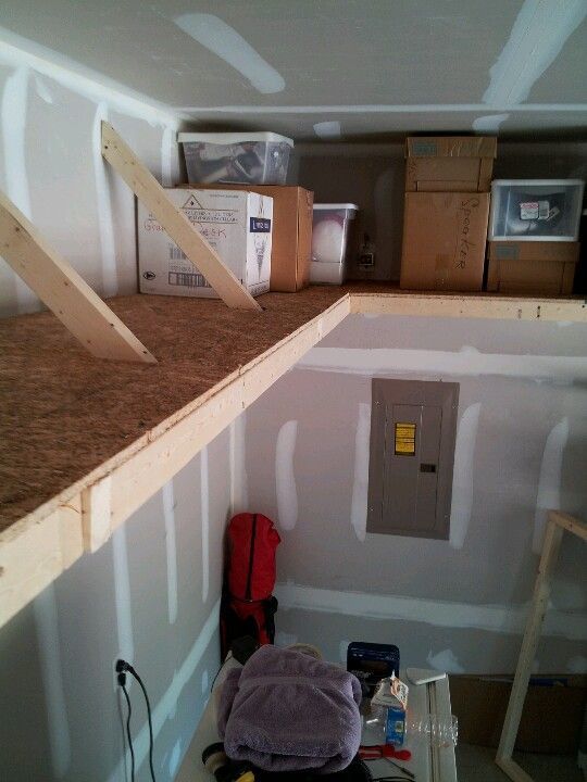 a room that is under construction with some boxes on the floor