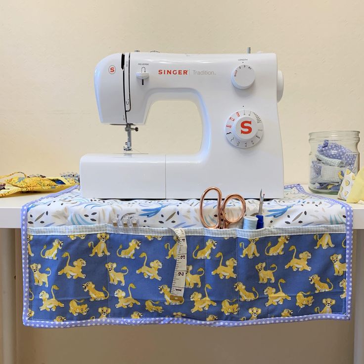 a sewing machine sitting on top of a table