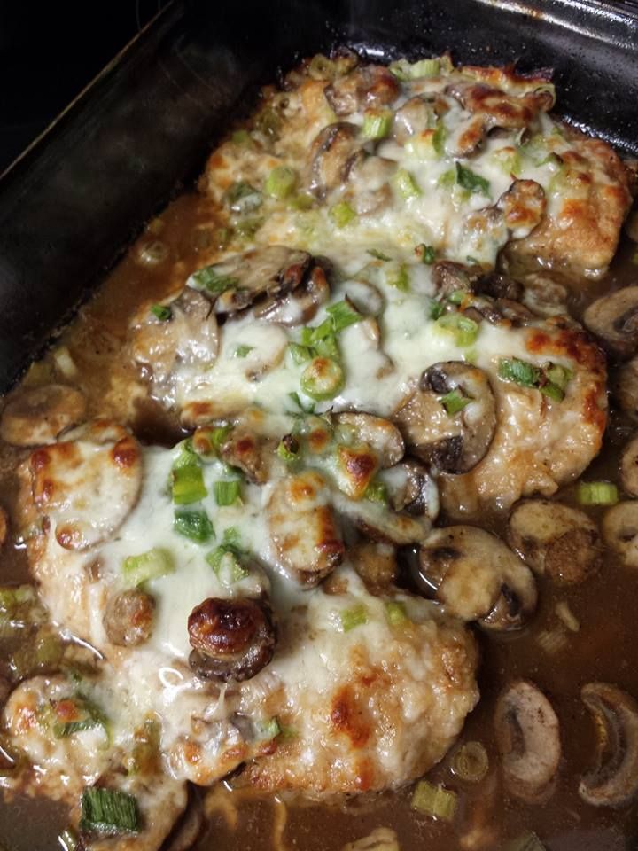 chicken with mushrooms and cheese in a pan